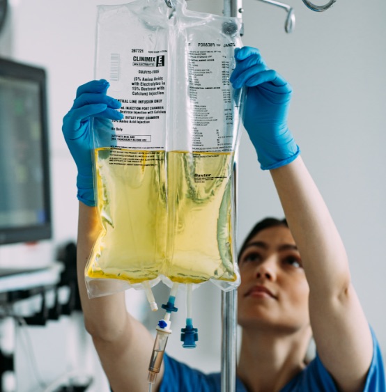 Nurse holding Clinimix bag